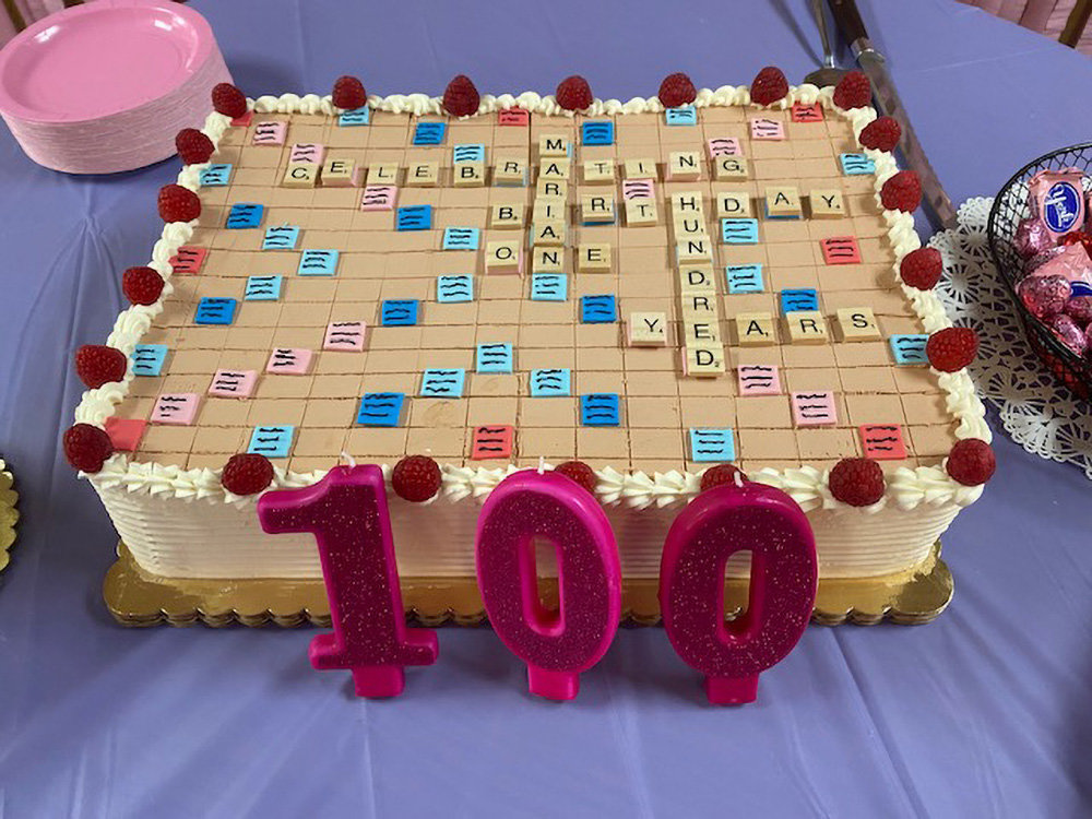 A special ‘Scrabble’ cake spelled out “Celebrating Marian Birthday – One Hundred Years.”